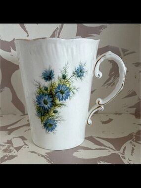 White Porcelain Floral Accent Mug with Blue Flowers